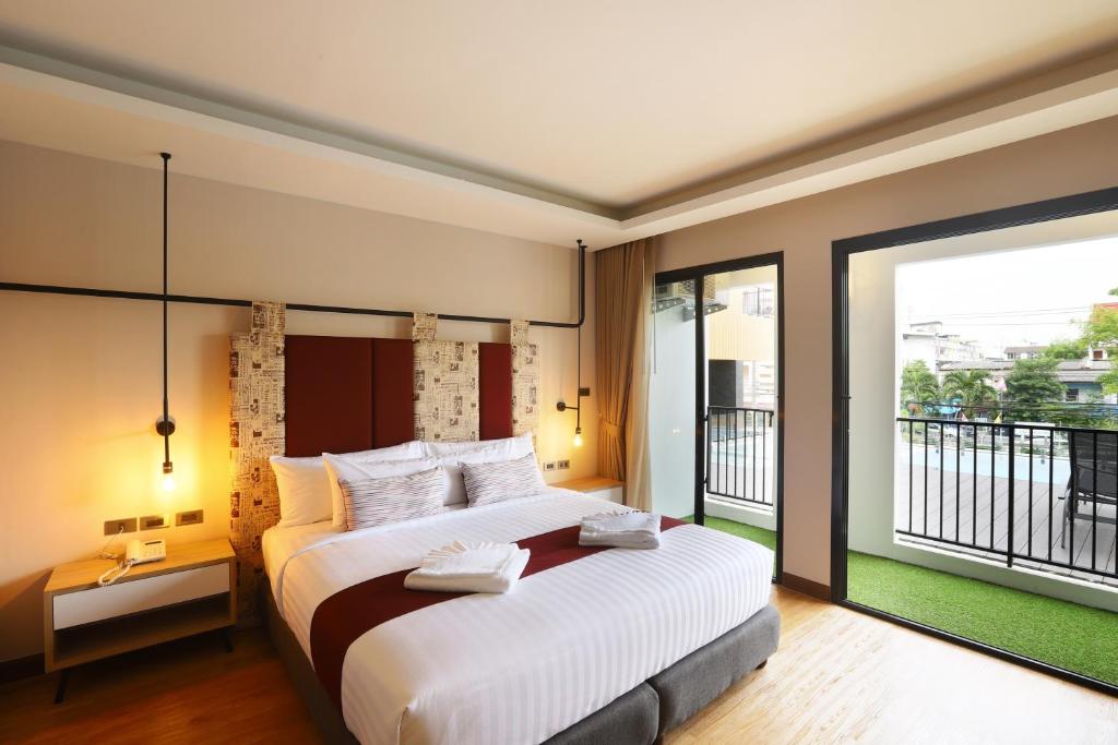 Postel nebo postele na pokoji v ubytování W3 Hotel
