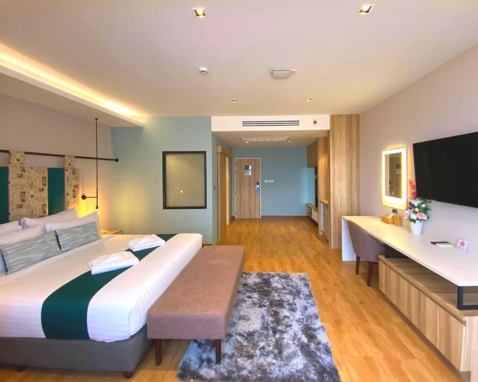 Postel nebo postele na pokoji v ubytování W3 Hotel