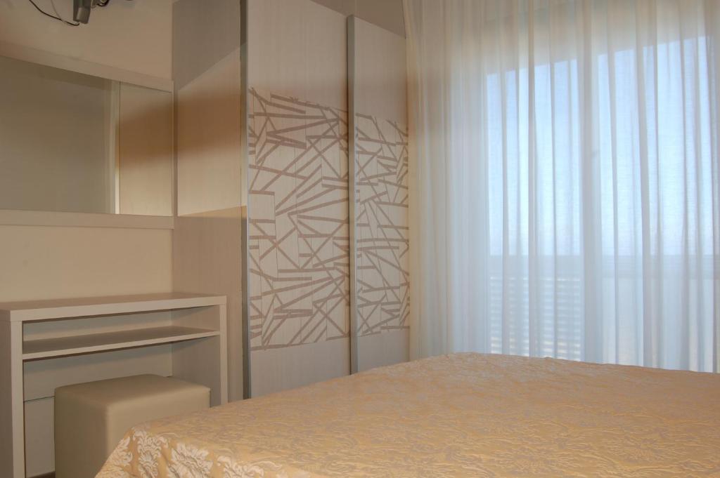 Postel nebo postele na pokoji v ubytování Hotel Alba D'Oro