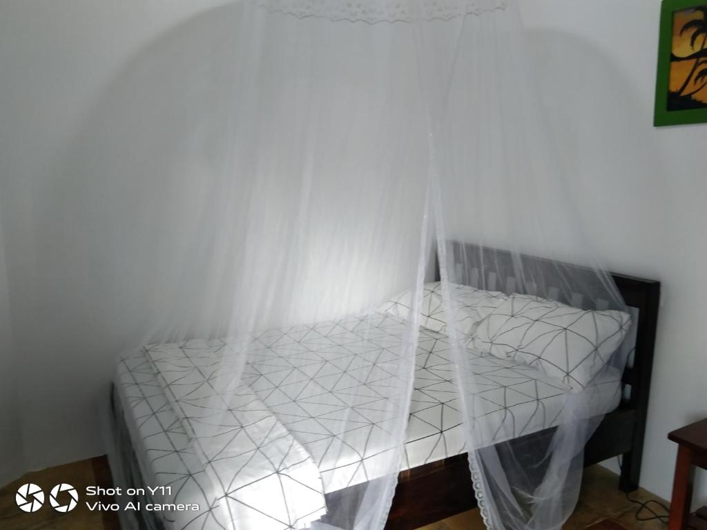 Postel nebo postele na pokoji v ubytování Jeno Tourist Inn