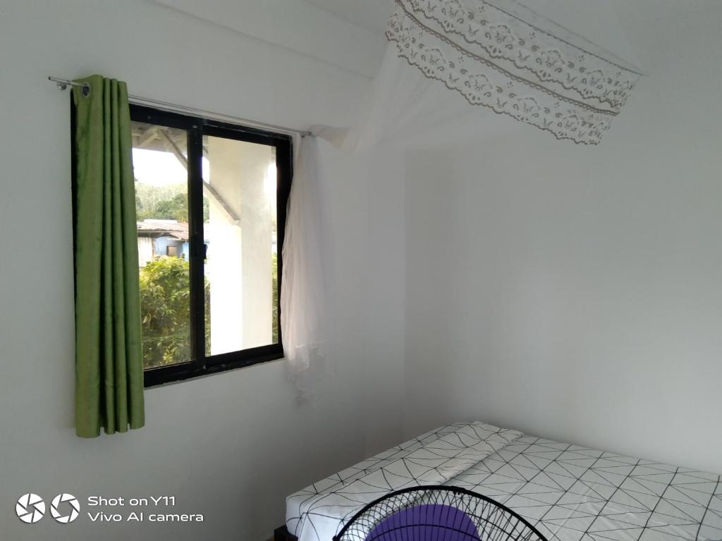 Postel nebo postele na pokoji v ubytování Jeno Tourist Inn