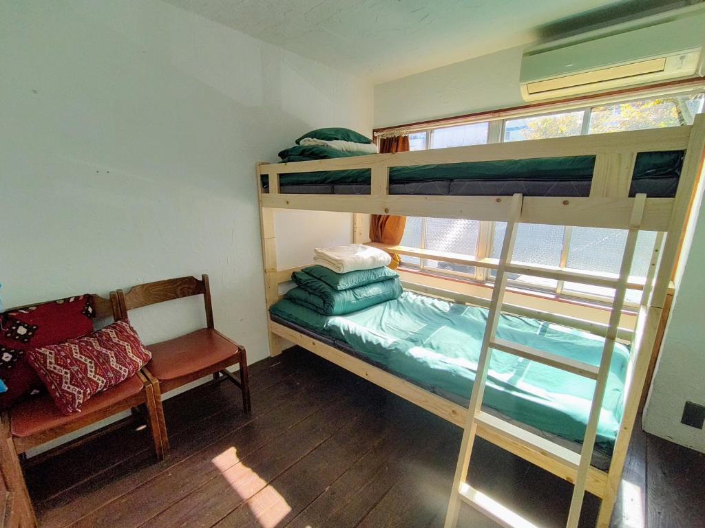Postel nebo postele na pokoji v ubytování Guest House mii