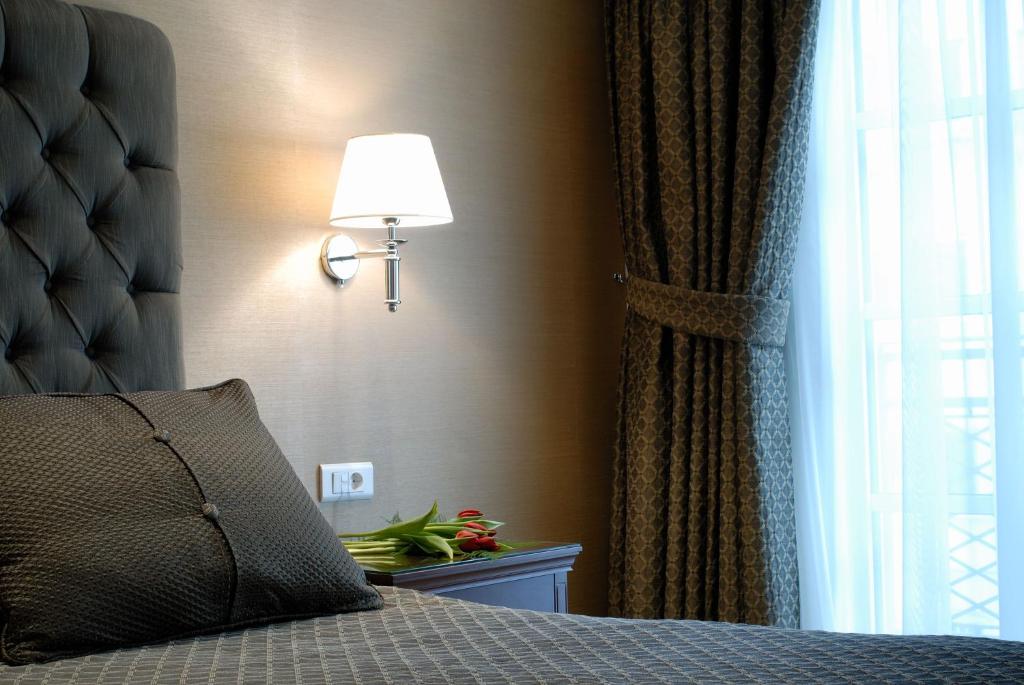 Postel nebo postele na pokoji v ubytování Hera Hotel