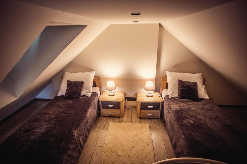 Posteľ alebo postele v izbe v ubytovaní Apartament LUX Ustroń