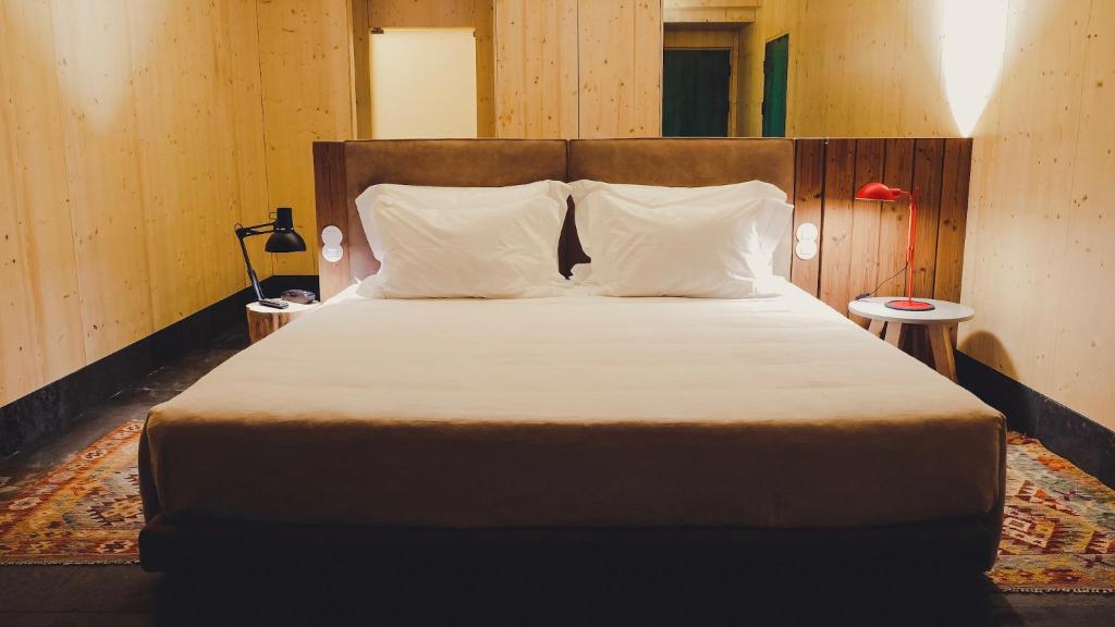 Postel nebo postele na pokoji v ubytování FeelViana Sport Hotel