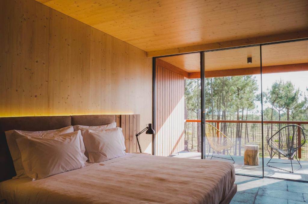 Postel nebo postele na pokoji v ubytování FeelViana Sport Hotel