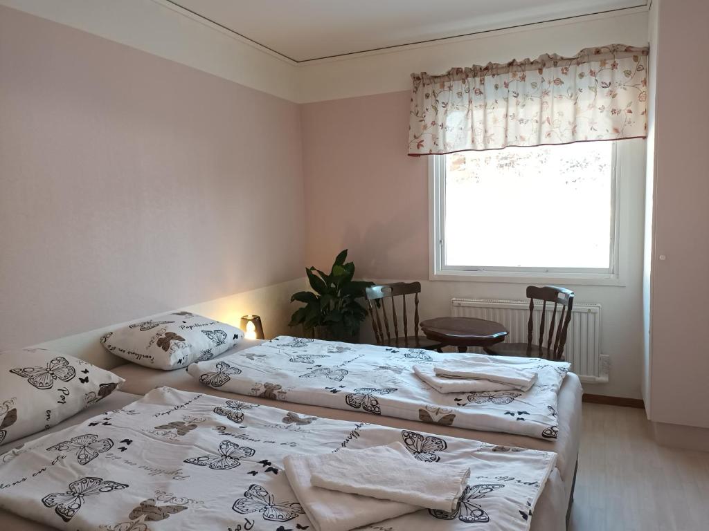 Postel nebo postele na pokoji v ubytování Dals Långeds B&B