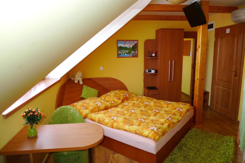 Postel nebo postele na pokoji v ubytování Penzion Rogallo