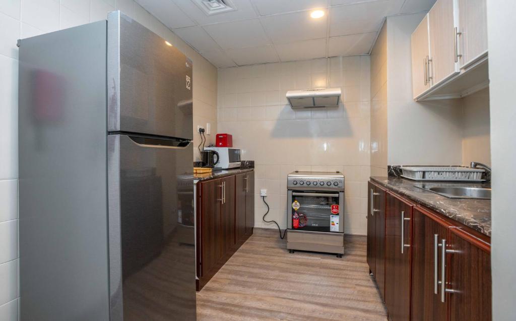 Cucina o angolo cottura di Ezdan Hotel, Residences