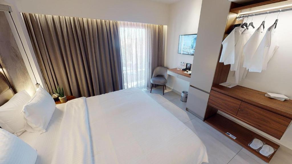Postel nebo postele na pokoji v ubytování DOM Boutique Hotel