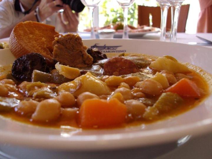 a white plate of food on a table at Hotel Ayamontino in Punta Umbría