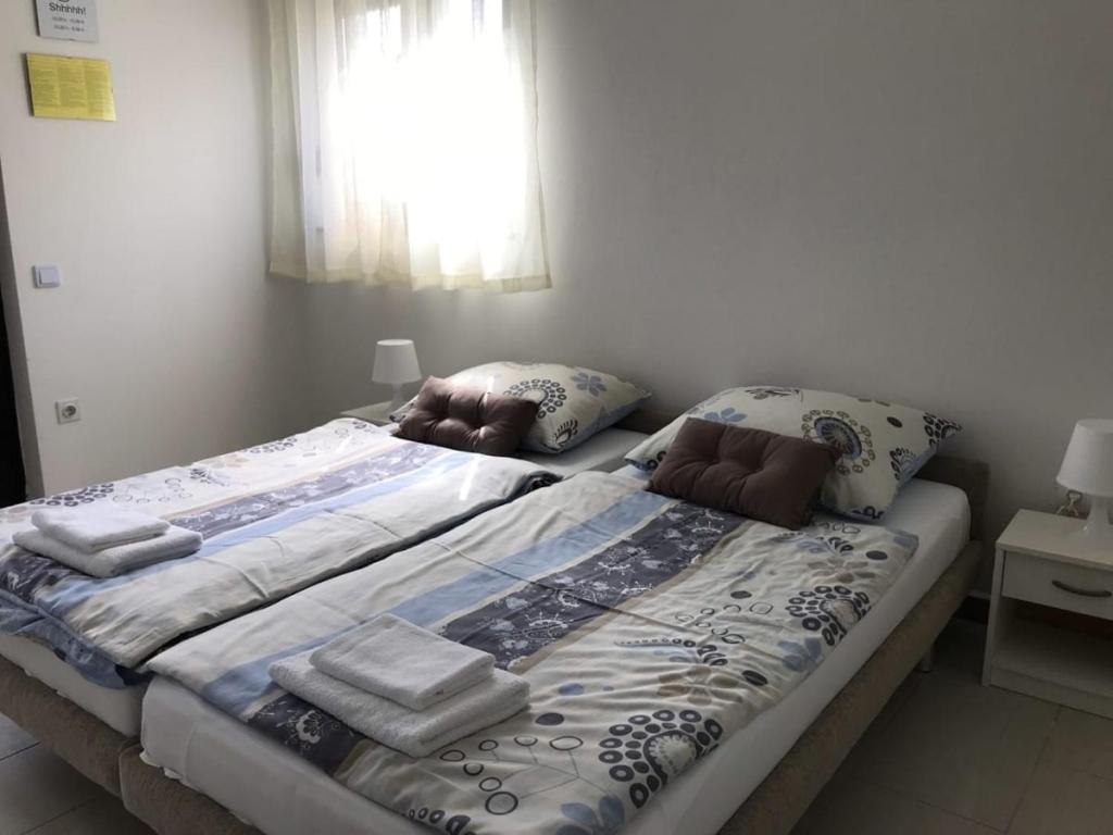 Postel nebo postele na pokoji v ubytování Apartment in Lopar with sea view, terrace, air conditioning, WiFi 4607-1