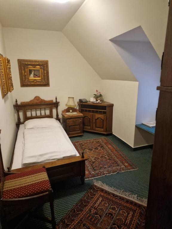 Postel nebo postele na pokoji v ubytování Hotel Razgorsek