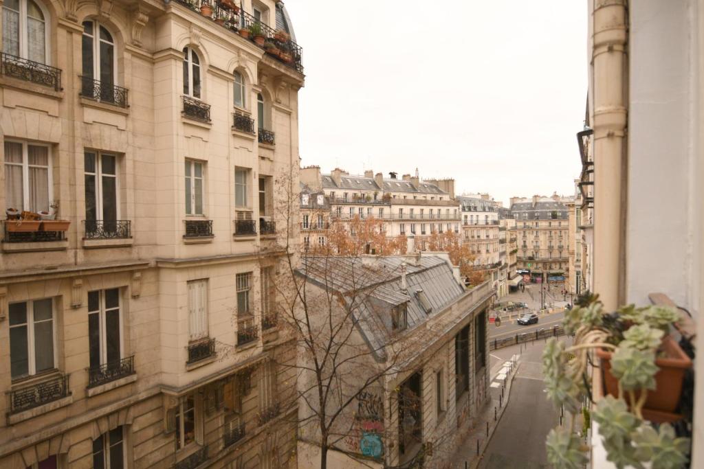 a view of a city street with buildings at Orléans in Paris