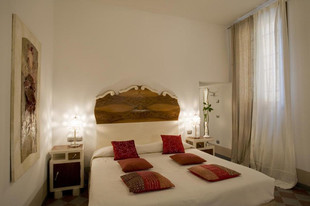 Łóżko lub łóżka w pokoju w obiekcie Art Hotel Al Fagiano