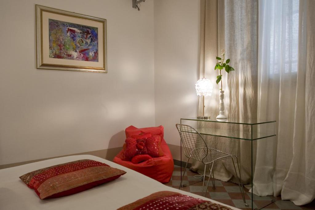 Łóżko lub łóżka w pokoju w obiekcie Art Hotel Al Fagiano