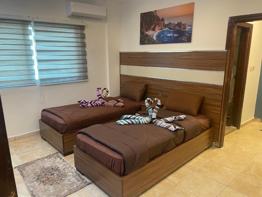 Postel nebo postele na pokoji v ubytování Al Deyafa Hotel