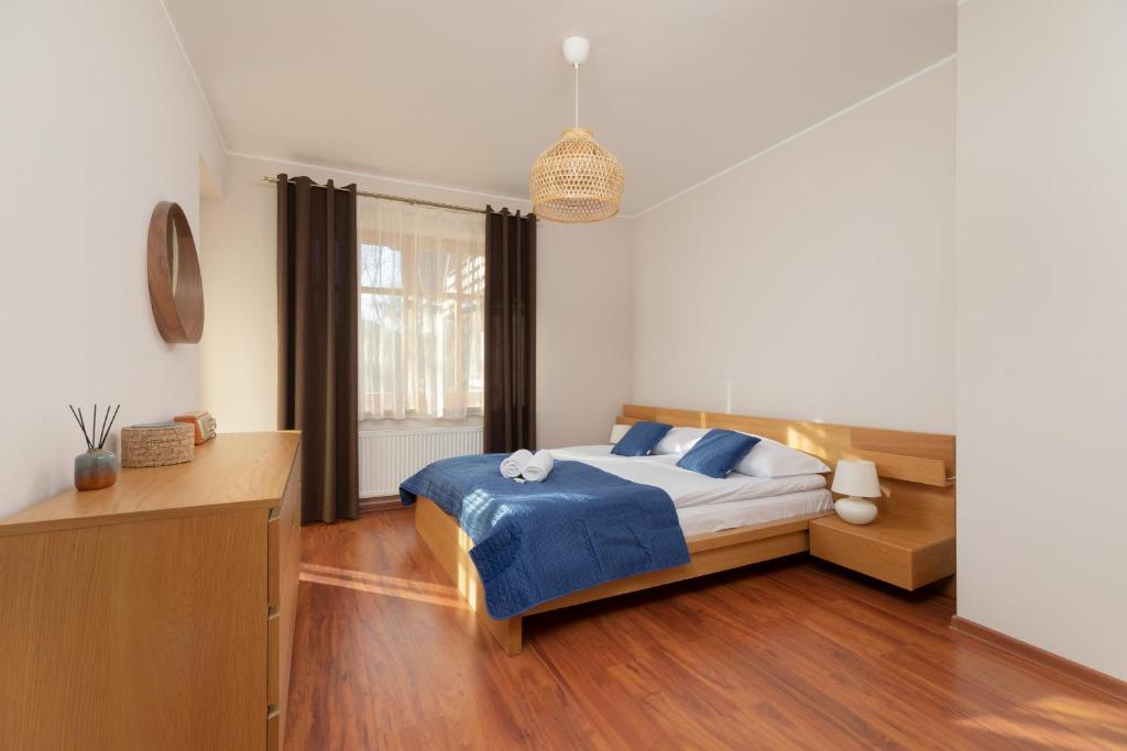 Posteľ alebo postele v izbe v ubytovaní Kaszelewskiego Apartment Zakopane by Noclegi Renters