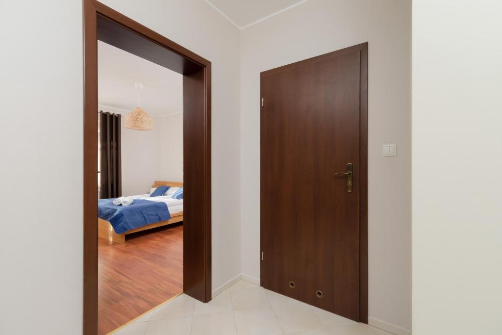 Posteľ alebo postele v izbe v ubytovaní Kaszelewskiego Apartment Zakopane by Noclegi Renters