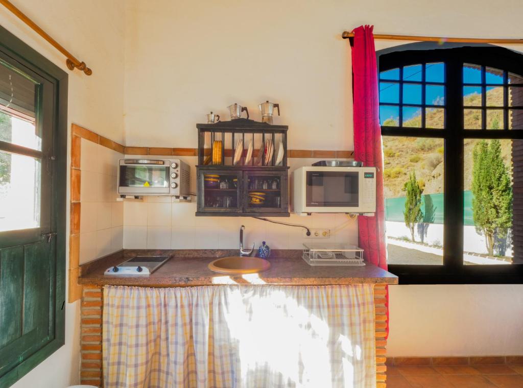 A kitchen or kitchenette at Cubo's Finca La Curva