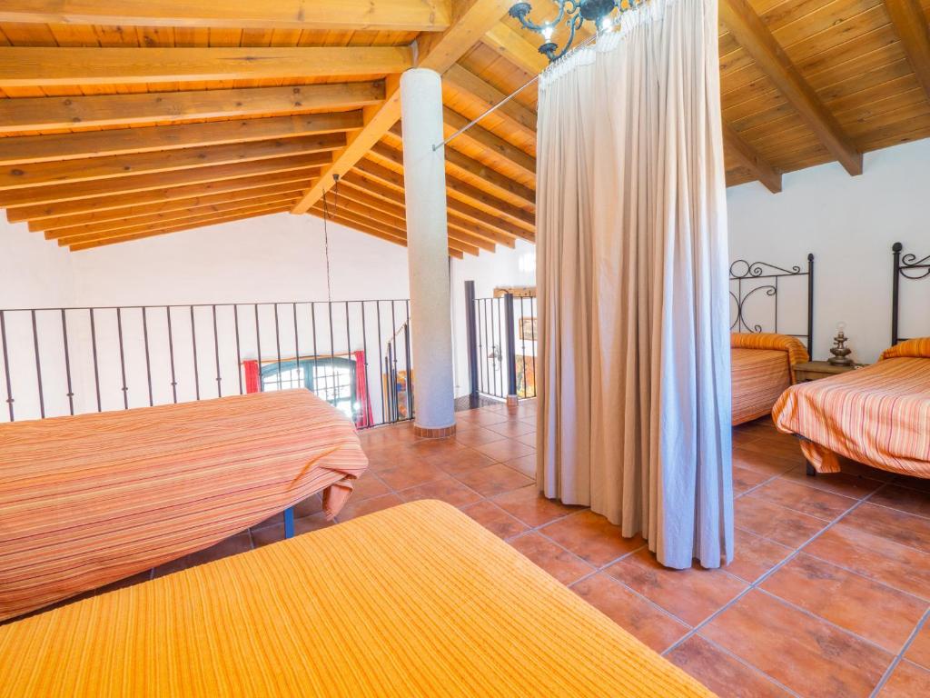 A bed or beds in a room at Cubo's Finca La Curva
