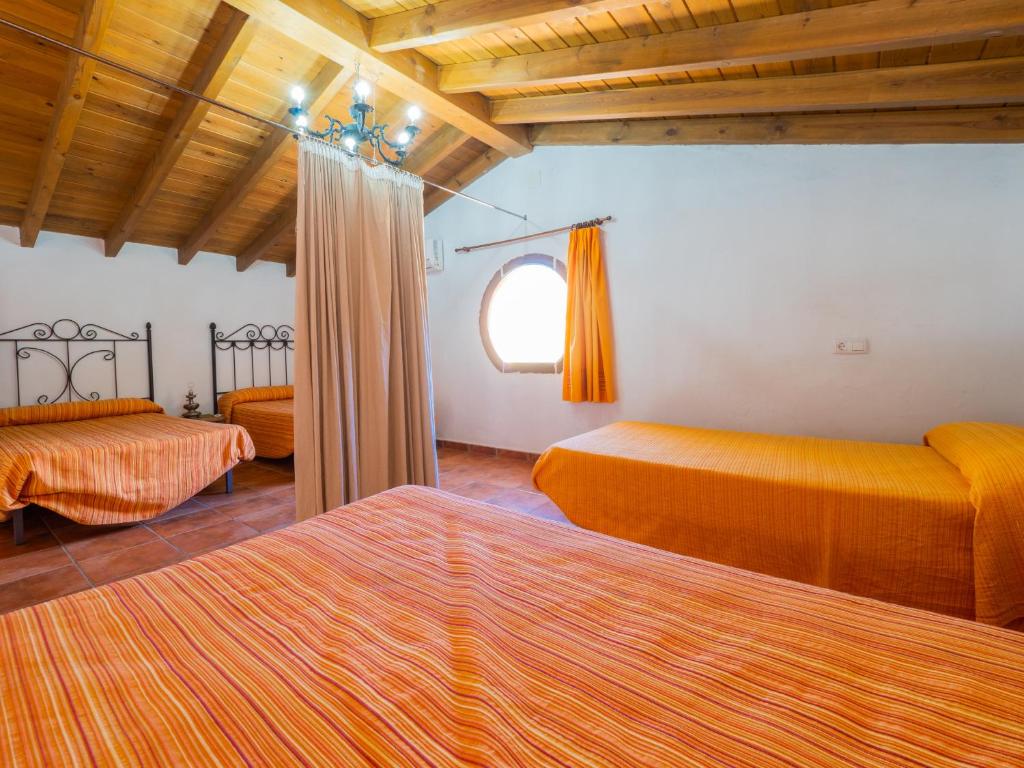 A bed or beds in a room at Cubo's Finca La Curva