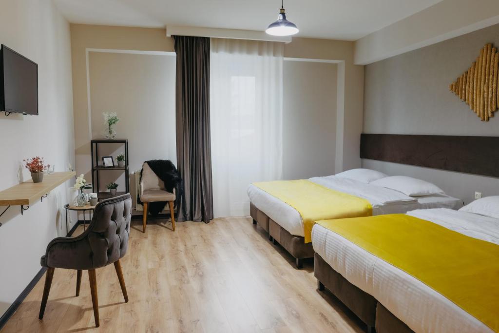 Postel nebo postele na pokoji v ubytování GABATA INN