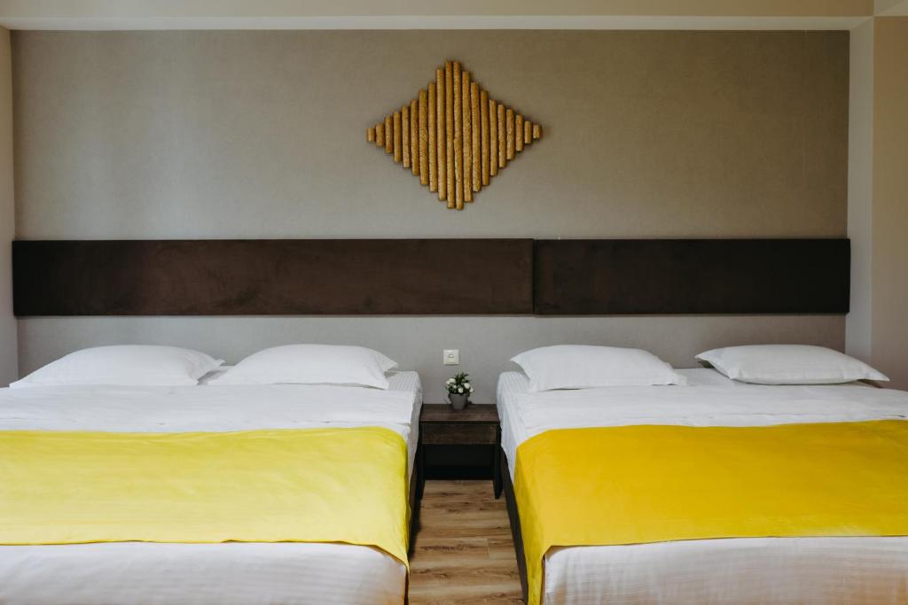 Postel nebo postele na pokoji v ubytování GABATA INN