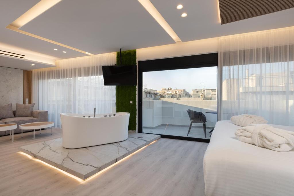 Postel nebo postele na pokoji v ubytování Incanto Boutique Suites - Mets