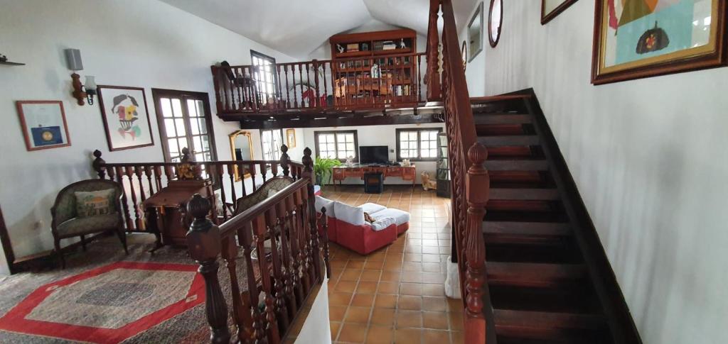 a room with a staircase and a living room at Habitaciones Doña Cris in Puerto del Carmen