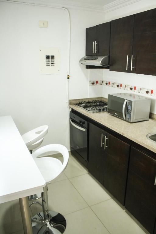 Kuchyň nebo kuchyňský kout v ubytování Apartahotel Kelly