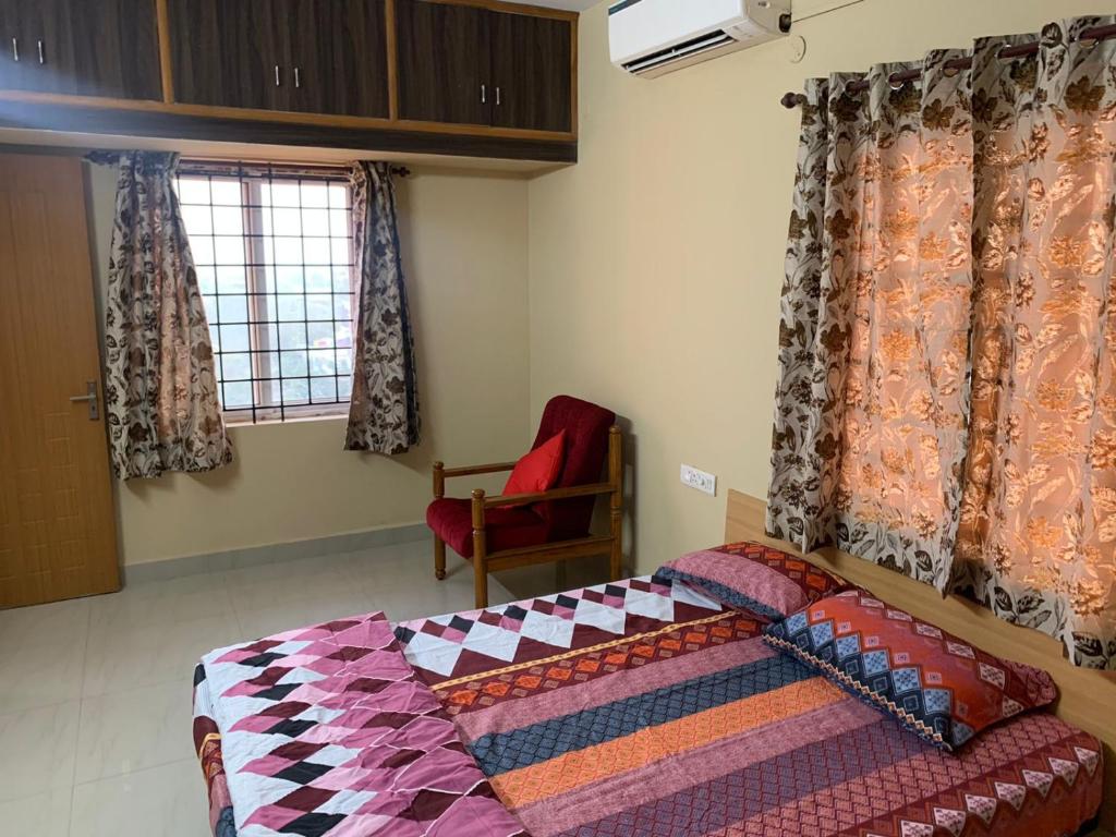 Tempat tidur dalam kamar di Sunil Residency