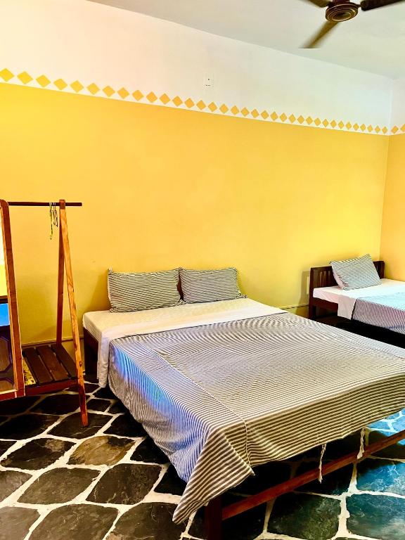 Postel nebo postele na pokoji v ubytování Paris Guest House