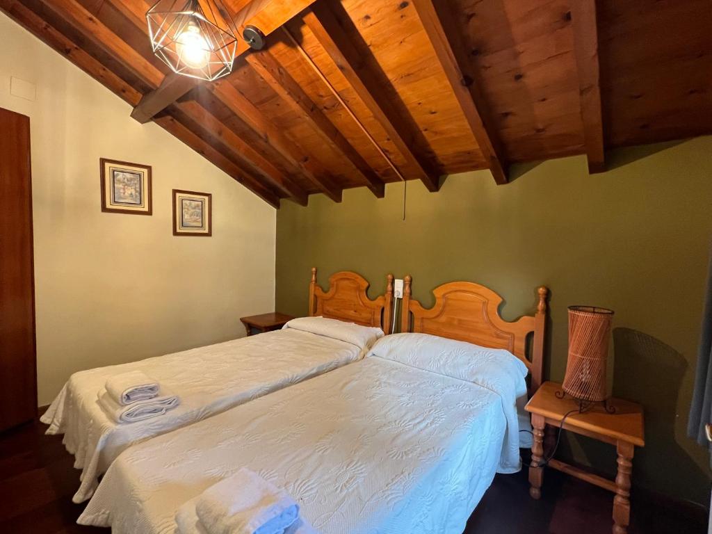 A bed or beds in a room at Complejo la Regalina