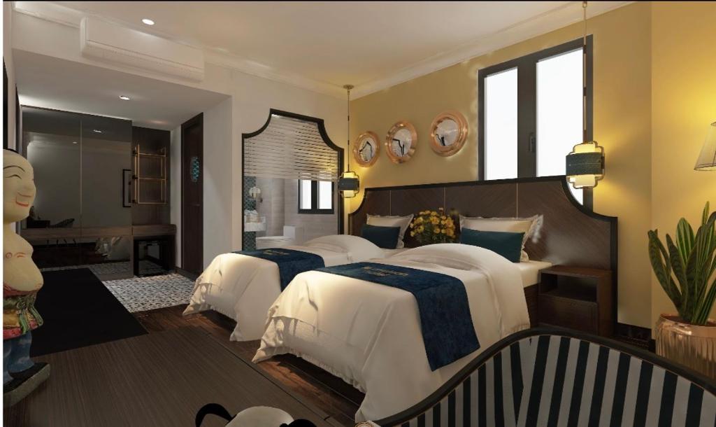 a bedroom with two beds and a bathroom at Ha Long Essence Premium Hotel in Ha Long