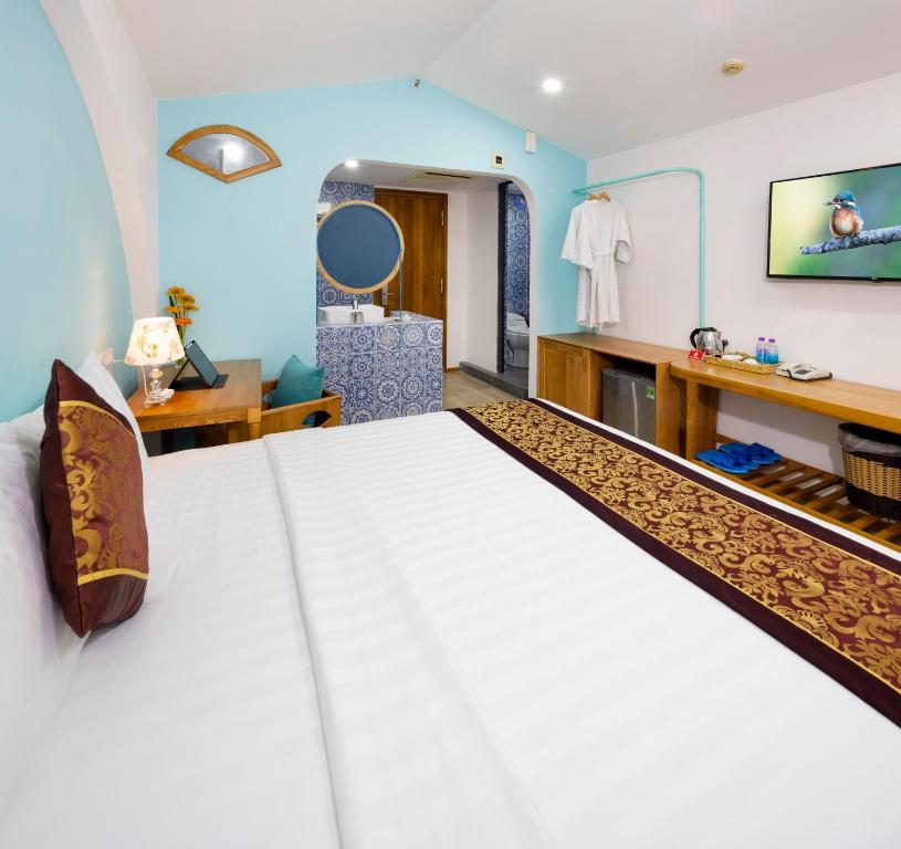 Postel nebo postele na pokoji v ubytování Prime New Hotel