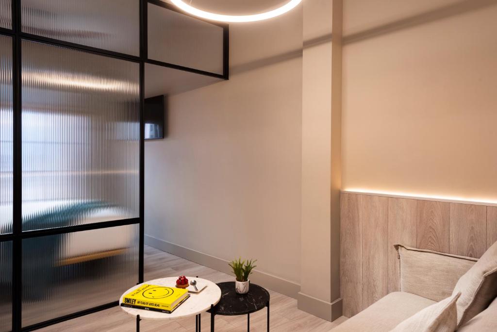 A bed or beds in a room at Coeo Peña Design Apartments