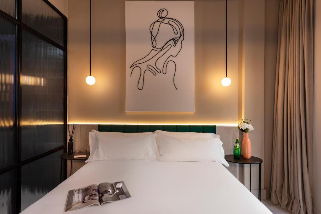 A bed or beds in a room at Coeo Peña Design Apartments