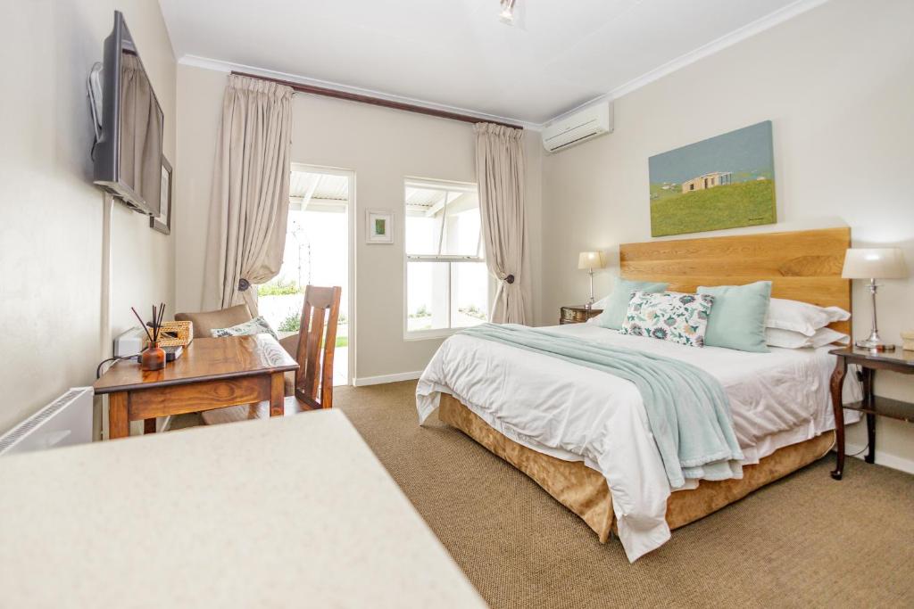 A bed or beds in a room at The Ashford
