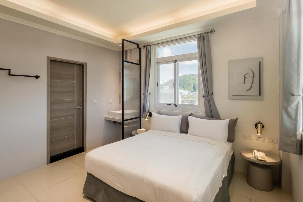 Postel nebo postele na pokoji v ubytování Zhudeng 1965 Hotel