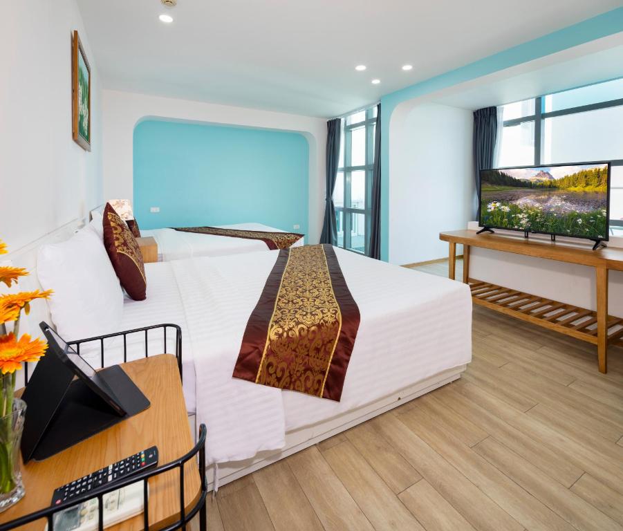 Postel nebo postele na pokoji v ubytování Prime New Hotel