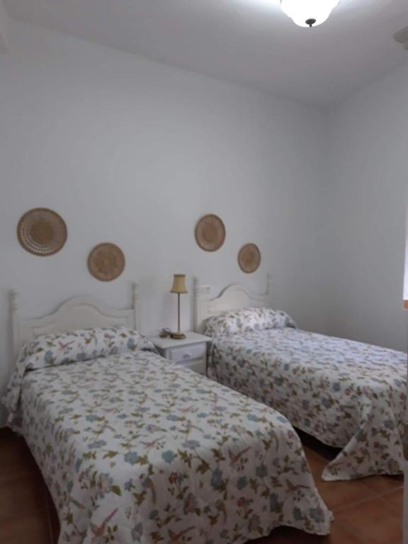 Postel nebo postele na pokoji v ubytování Casa Rural La Maestra