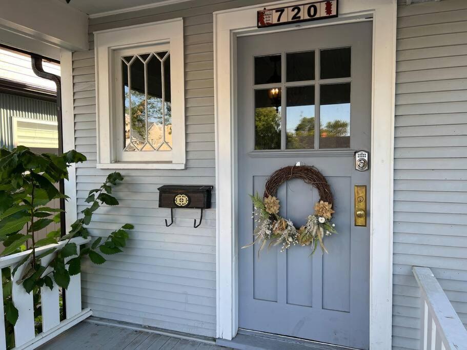 a front door of a house with a wreath on it at Timelessly restored home - entirely yours to enjoy in Billings