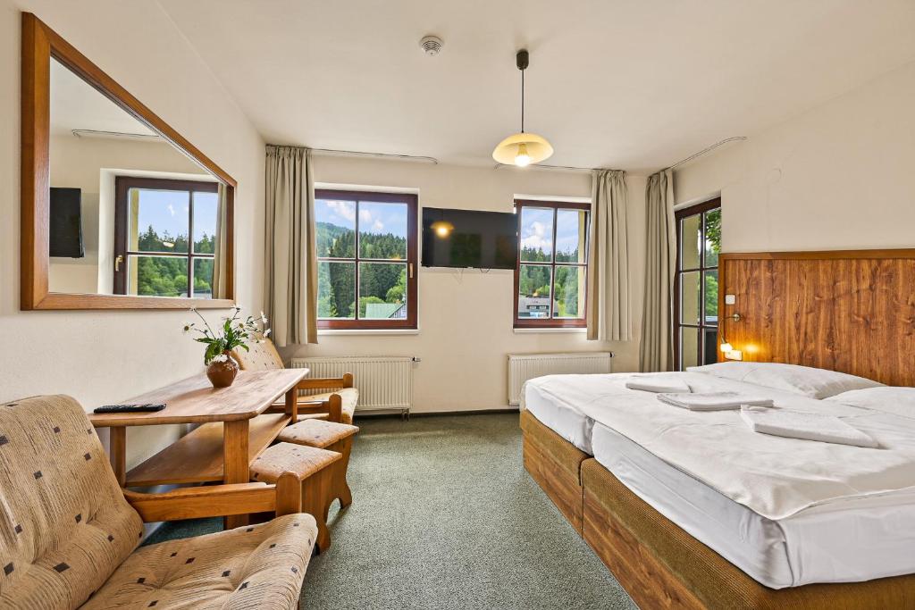 Postel nebo postele na pokoji v ubytování David Wellness Hotel
