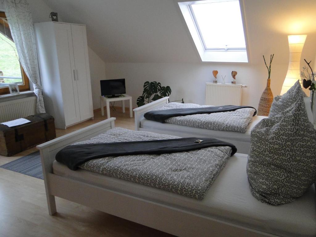 Postel nebo postele na pokoji v ubytování Ferienwohnung Hotte´s Hütte