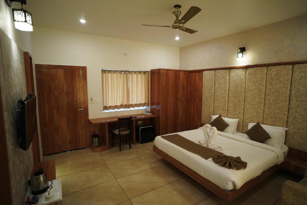Postel nebo postele na pokoji v ubytování Amar Bagh Resort