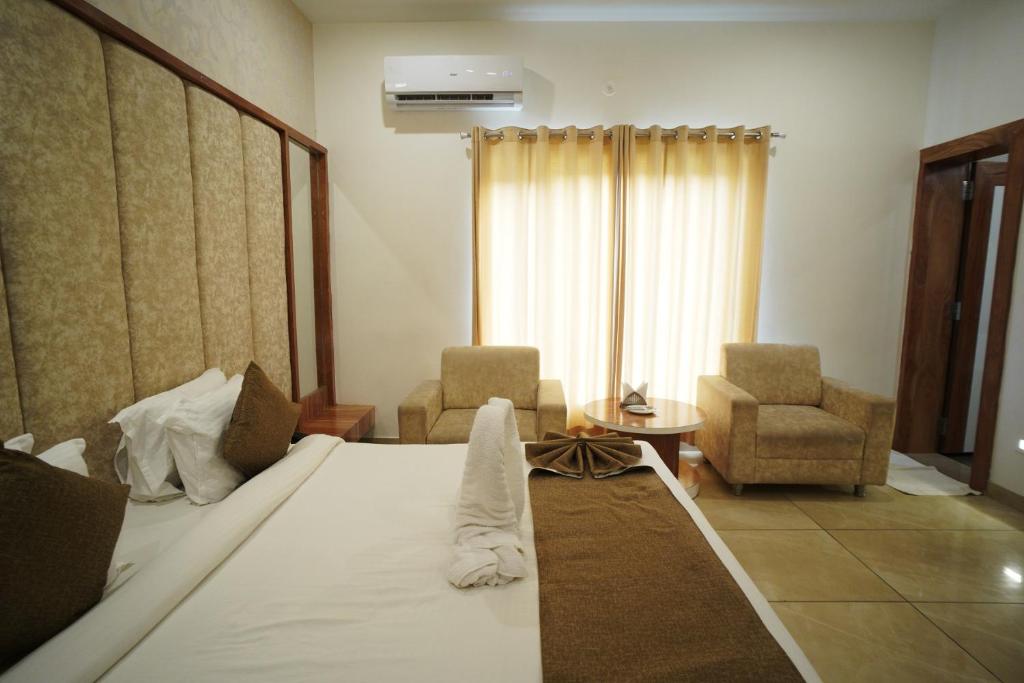 Postel nebo postele na pokoji v ubytování Amar Bagh Resort