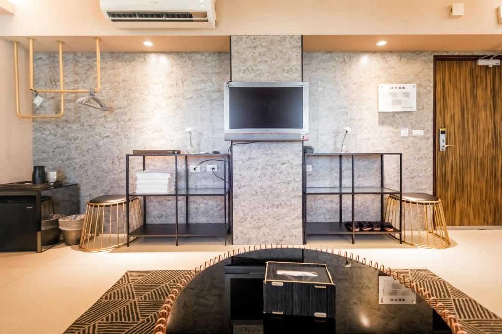 TV a/nebo společenská místnost v ubytování Zhudeng 1965 Hotel