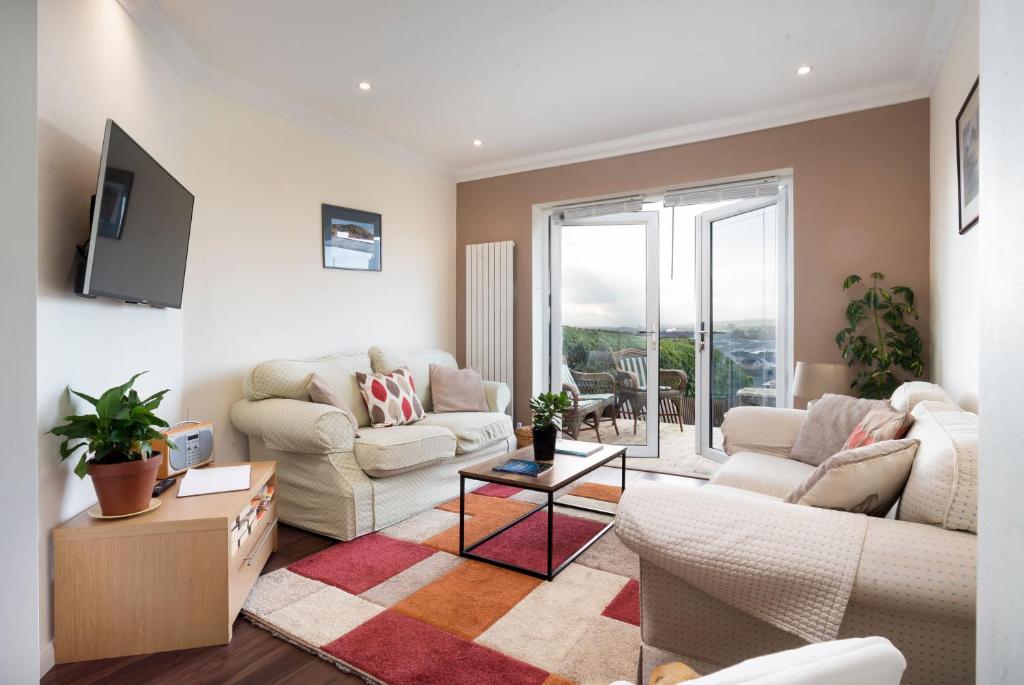 a living room with two couches and a tv at Fell View - Dog-Friendly House, Enclosed Garden & Great Views in Penrith