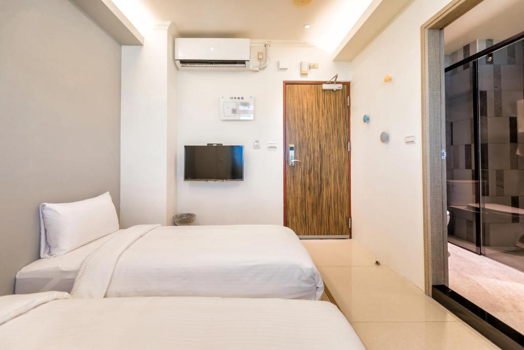 Postel nebo postele na pokoji v ubytování Zhudeng 1965 Hotel